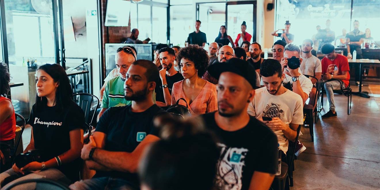 Audience of young people sitting in chairs